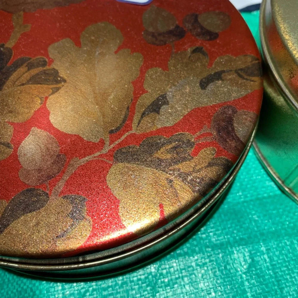 Decorative Red and Gold Tin with Leaf Design